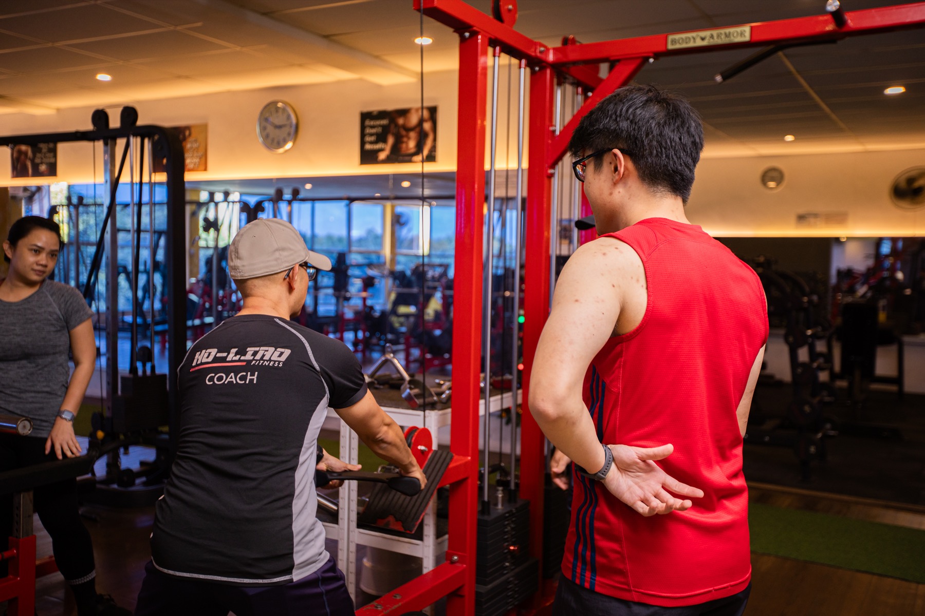 Coach Ho coaching participants during a gym training session